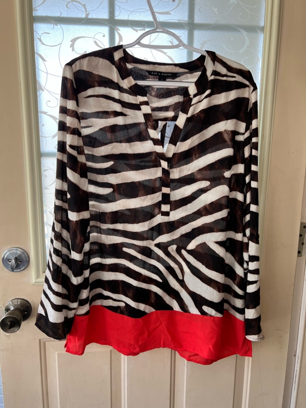 Zac& Rachel sz L zebra print tunic blouse with co treating vibrant coral band.
